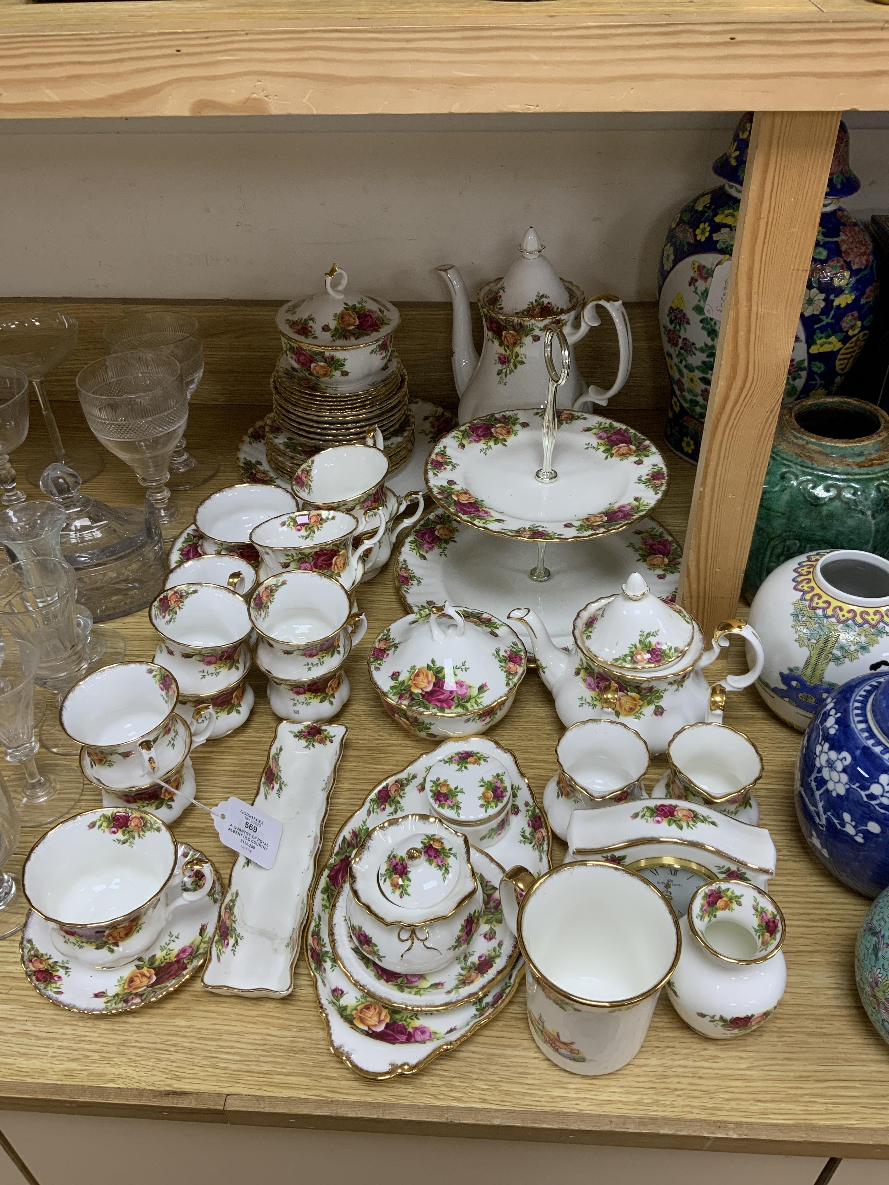 A quantity of Royal Albert old country roses pattern teawares including teapot, various cups and saucers, side plates, cake stand, coffee, pot, quartz, clock, sugar bowl, trays, etc.